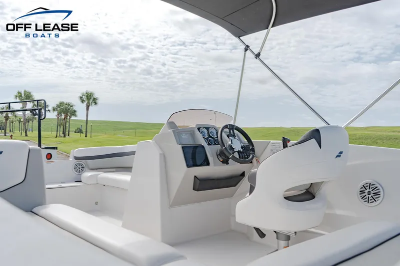 Slide: The Image of 2022 Starcraft SVX 191 OB boat interior with steering console and seating. - 5