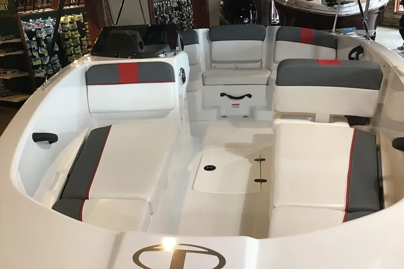 Slide: The Image of 2024 Tahoe T16 boat interior with gray and red seating. - 1