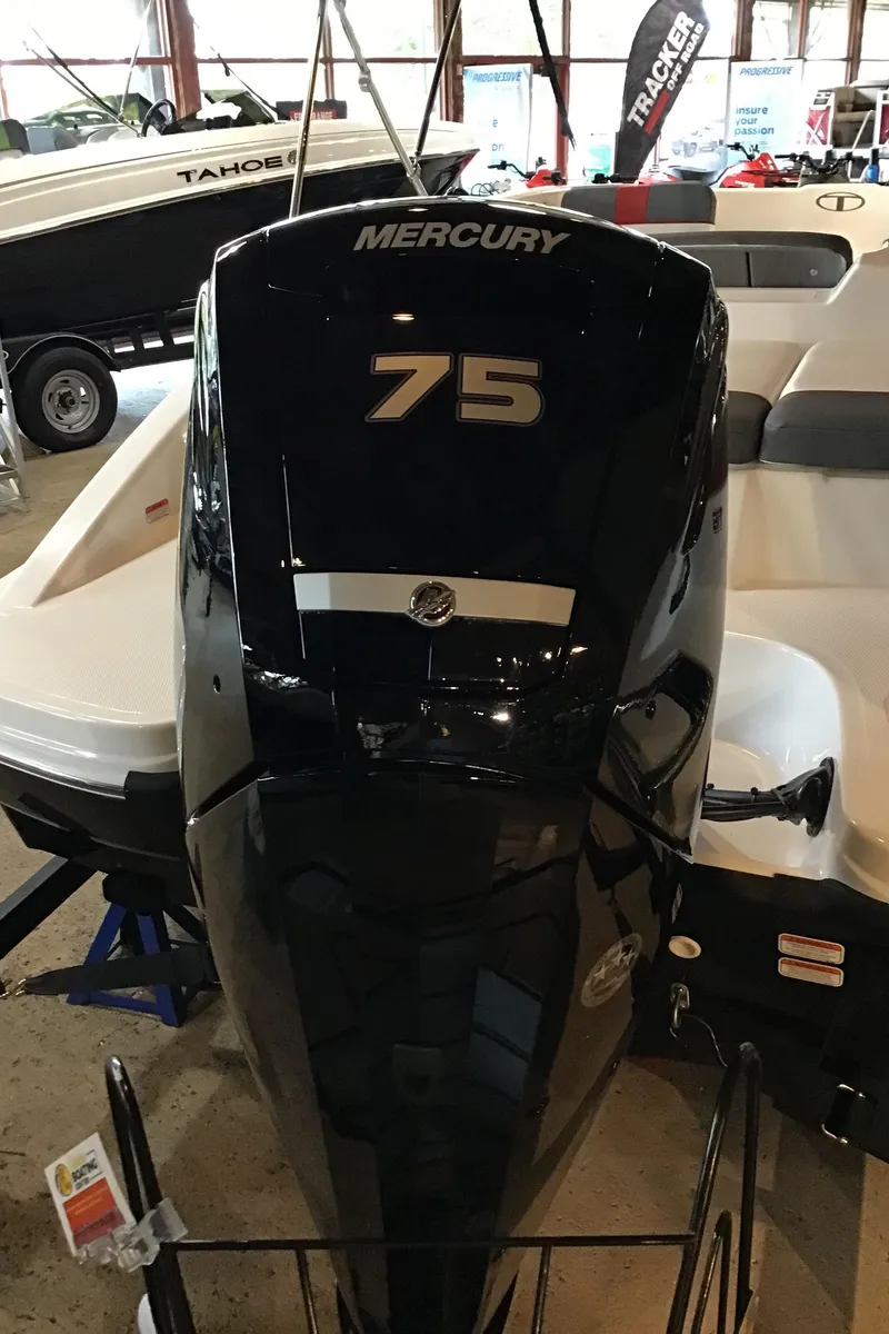 Slide: The Image of 2024 Tahoe T16 boat with Mercury 75 engine displayed indoors. - 4