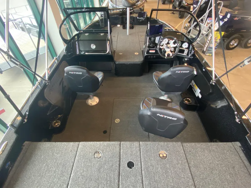 Slide: The Image of 2024 Nitro ZV19 Sport Pro boat interior with seating and dashboard. - 3