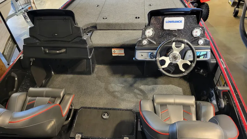 Slide: The Image of 2024 Nitro Z19 boat interior with steering wheel and seating. - 2
