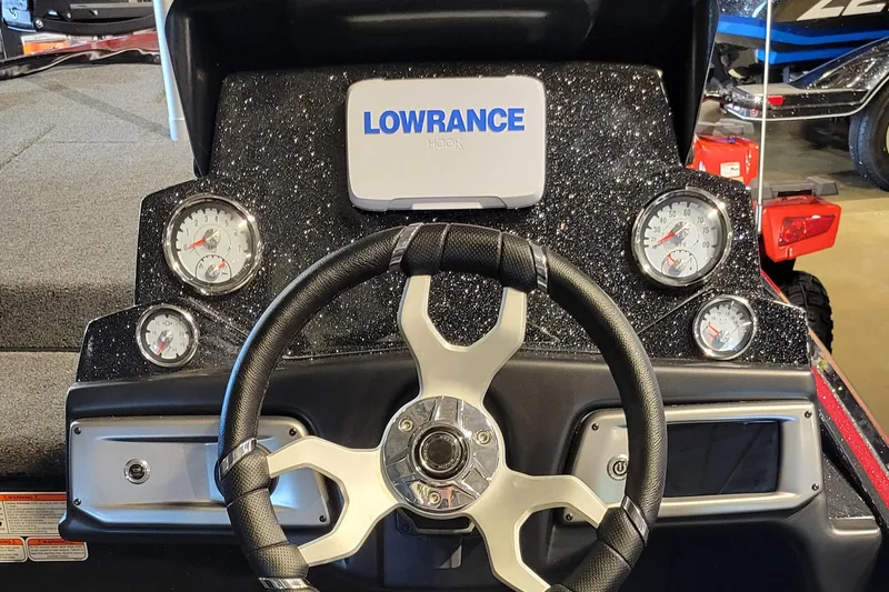 Slide: The Image of 2024 Nitro Z19 boat dashboard with Lowrance display and gauges. - 3