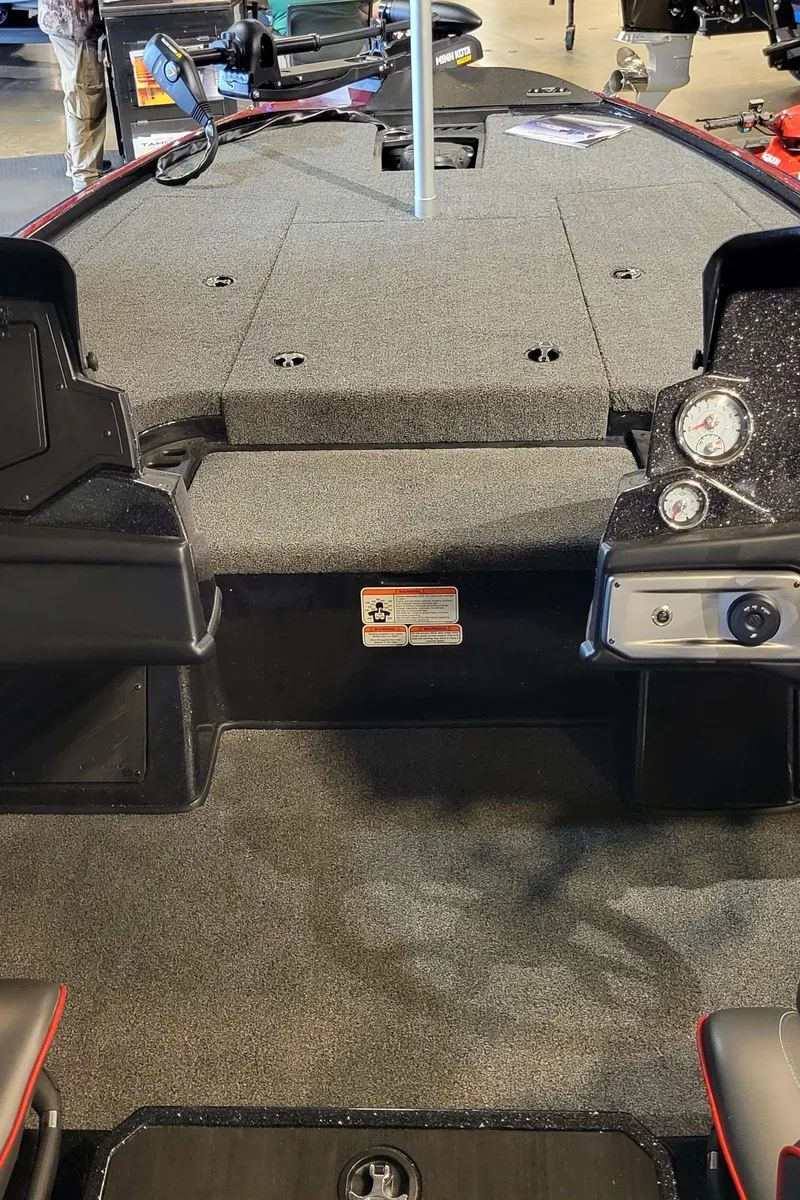 Slide: The Image of 2024 Nitro Z19 boat interior with carpeted deck and control panel. - 4