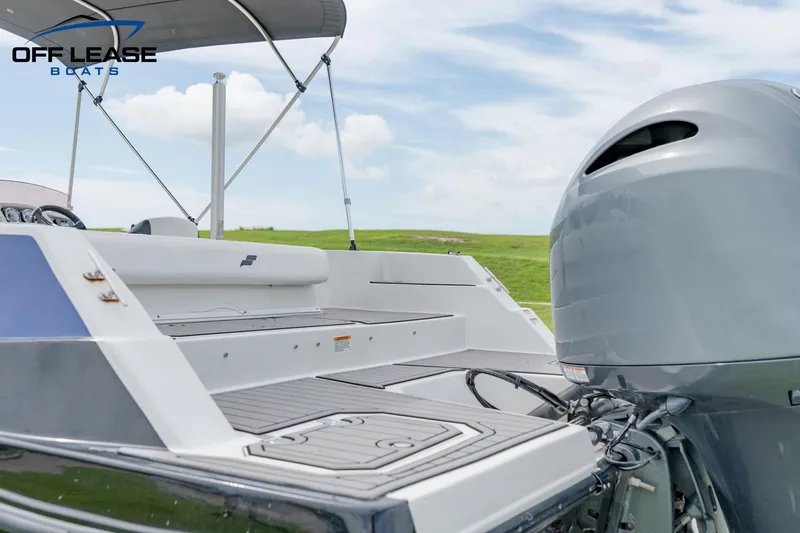 Slide: The Image of 2022 Starcraft SVX 231 OB boat with outboard motor and spacious deck. - 12