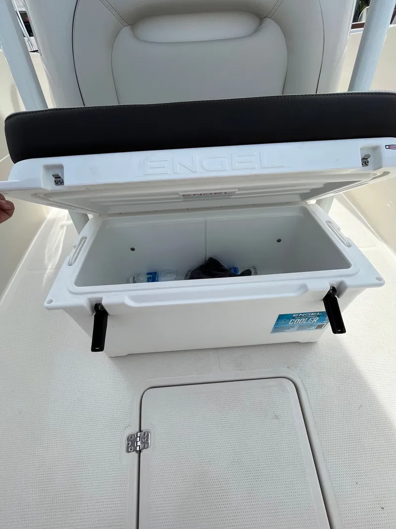Slide: The Image of Open storage compartment on a 2023 Sailfish 290 CC boat. - 13