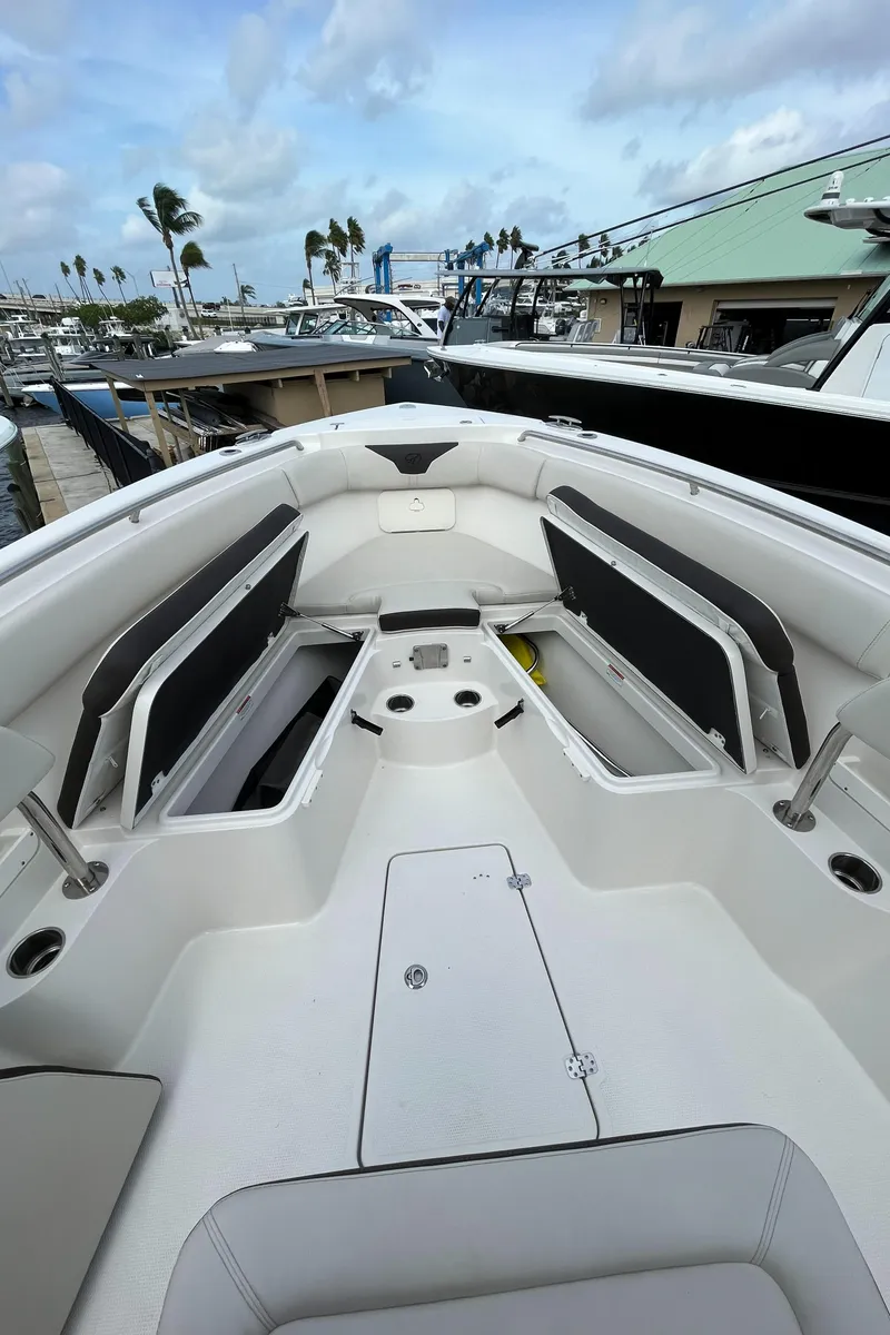 Slide: The Image of 2023 Sailfish 290 CC boat interior at a marina. - 28