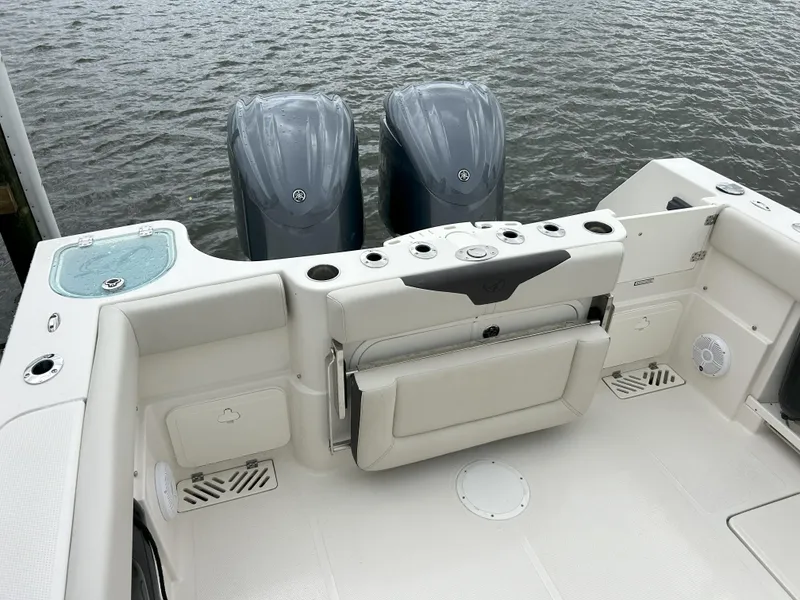 Slide: The Image of 2023 Sailfish 290 CC boat stern with twin outboard motors. - 37