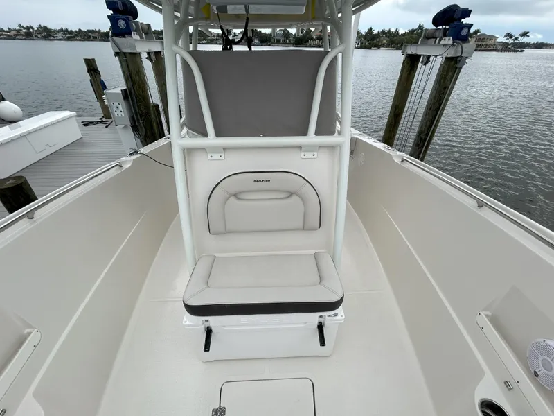 Slide: The Image of 2023 Sailfish 290 CC boat interior with seating and storage. - 46