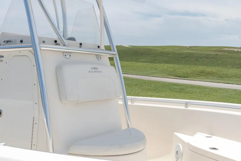 Slide: The Image of 2021 Cobia 201 Center Console boat interior with seating and console. - 8
