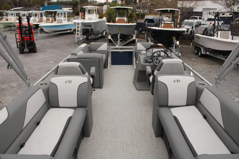 Slide: The Image of 2024 Avalon VENTURE QUAD LOUNGER pontoon boat with spacious seating and modern design. - 9