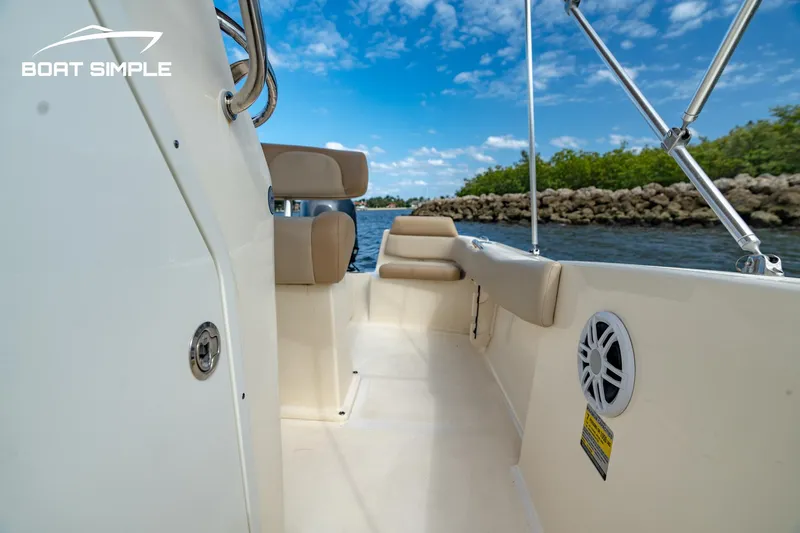Slide: The Image of 2021 Scout 195 Sportfish boat interior with seating, on a sunny day. - 10