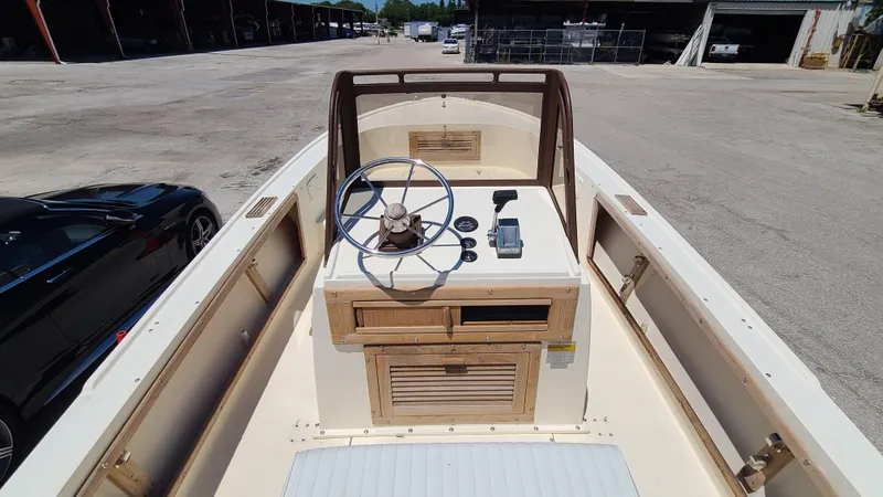 Slide: The Image of 1988 Mako 20 Center Console boat interior with steering wheel and controls. - 13