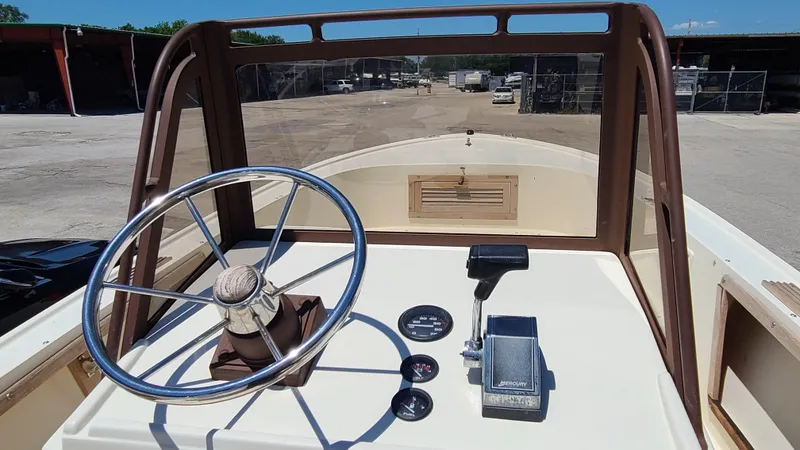 Slide: The Image of 1988 Mako 20 Center Console boat dashboard with steering wheel and controls. - 14