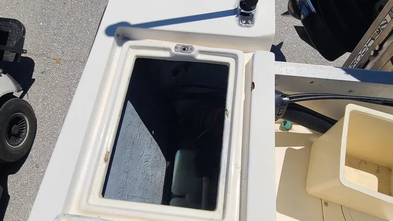 Slide: The Image of 1988 Mako 20 Center Console storage compartment. - 22