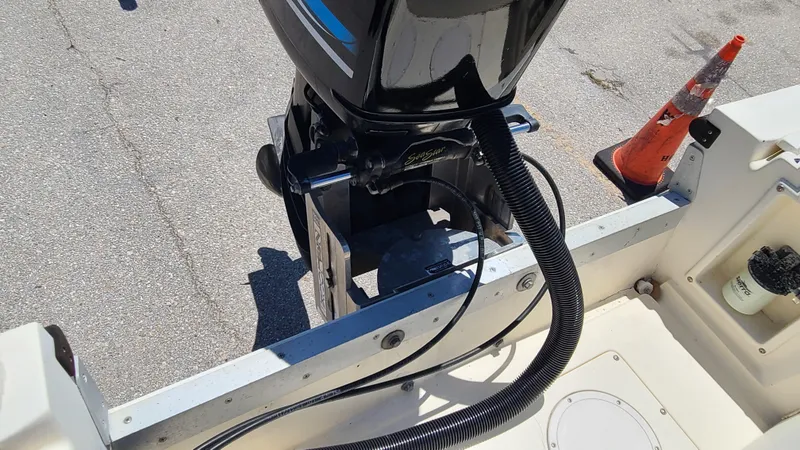 Slide: The Image of 1988 Mako 20 Center Console boat with outboard motor and safety cone. - 26