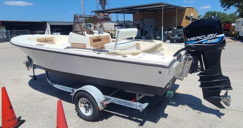 Slide: The Image of 1988 Mako 20 Center Console boat with Mercury engine on trailer. - 3