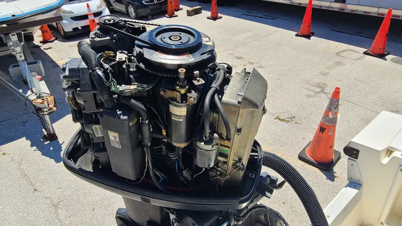 Slide: The Image of 1988 Mako 20 Center Console boat engine in a parking lot. - 30