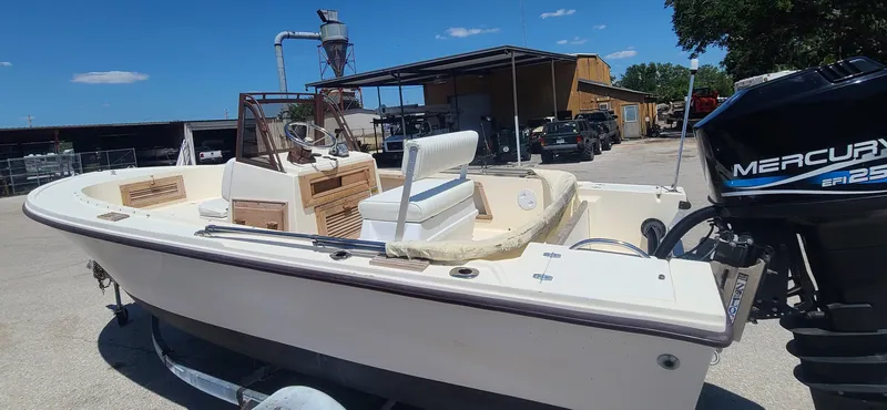 Slide: The Image of 1988 Mako 20 Center Console boat with Mercury outboard motor. - 4
