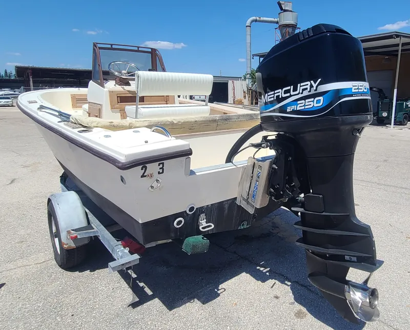 Slide: The Image of 1988 Mako 20 Center Console boat with Mercury 250 engine on trailer. - 5