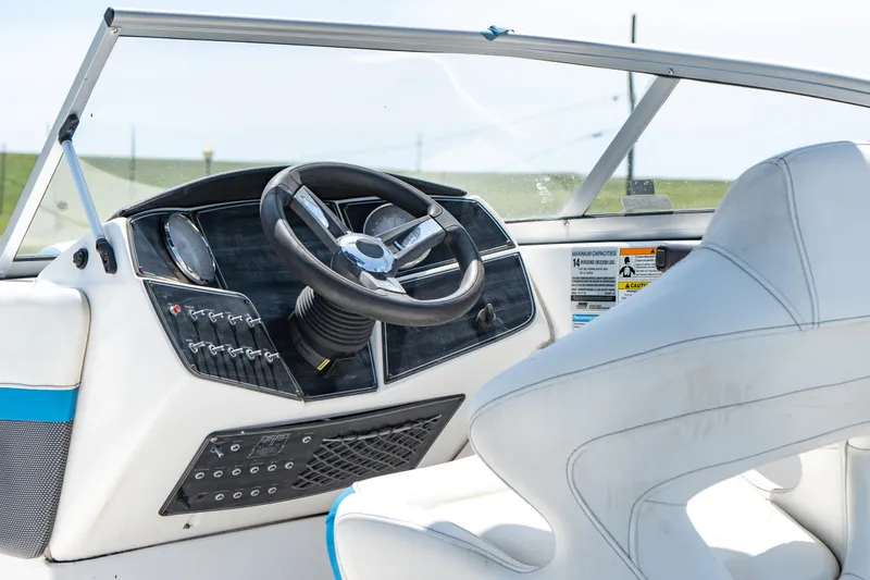 Slide: The Image of 2020 Hurricane 217 SD boat dashboard and steering wheel, close-up view. - 6