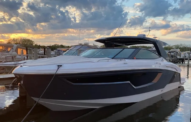 Slide: The Image of 2023 Cruisers Yachts 38 GLS OB at sunset in marina. - 1