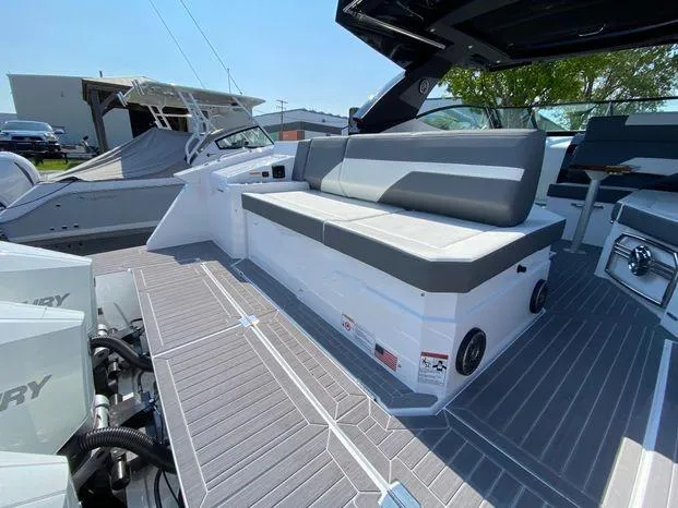 Slide: The Image of 2023 Cruisers Yachts 38 GLS OB with spacious seating and modern deck design. - 13