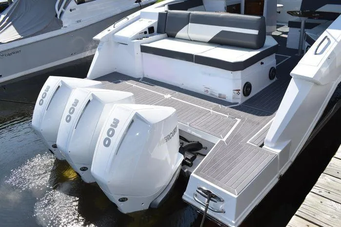 Slide: The Image of 2023 Cruisers Yachts 38 GLS OB with triple outboard engines docked. - 18