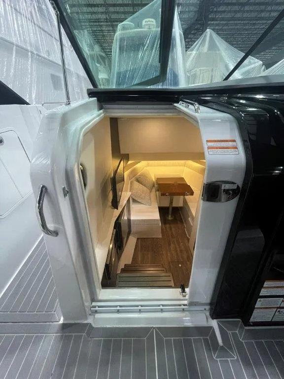 Slide: The Image of Interior view of 2023 Cruisers Yachts 38 GLS OB cabin with modern amenities. - 19