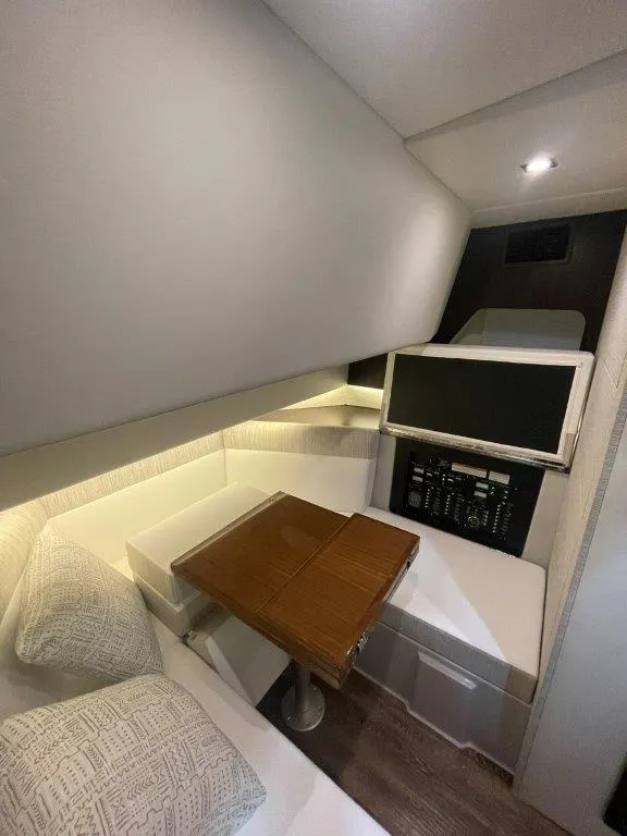 Slide: The Image of 2023 Cruisers Yachts 38 GLS OB cabin interior with seating and table. - 21