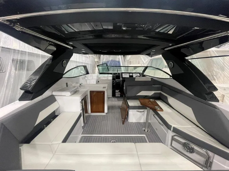 Slide: The Image of 2023 Cruisers Yachts 38 GLS OB interior with modern seating and sleek design. - 27