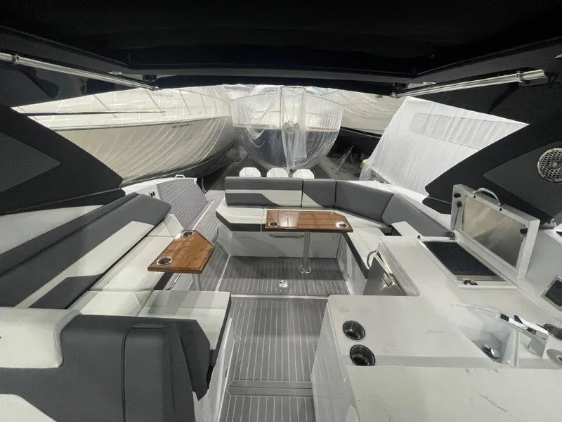 Slide: The Image of 2023 Cruisers Yachts 38 GLS OB interior with seating and tables. - 28