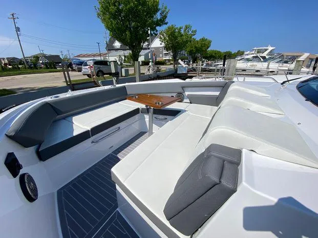 Slide: The Image of 2023 Cruisers Yachts 38 GLS OB with spacious seating and table on deck. - 3