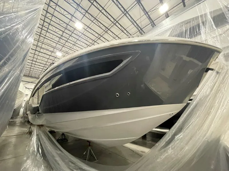 Slide: The Image of 2023 Cruisers Yachts 38 GLS OB in a storage facility, wrapped in protective plastic. - 33