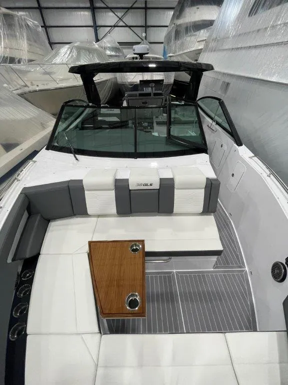 Slide: The Image of 2023 Cruisers Yachts 38 GLS OB luxury boat interior with seating and table. - 36