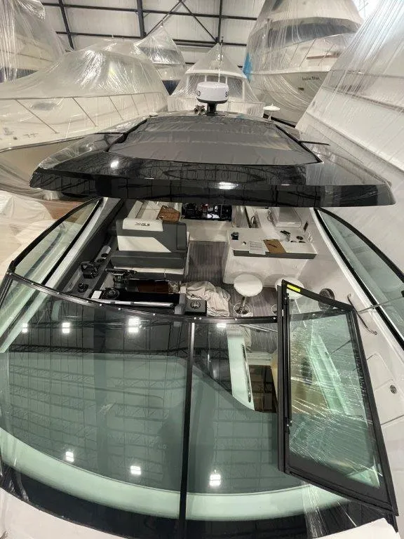 Slide: The Image of 2023 Cruisers Yachts 38 GLS OB in a showroom, top view of cockpit and interior. - 37