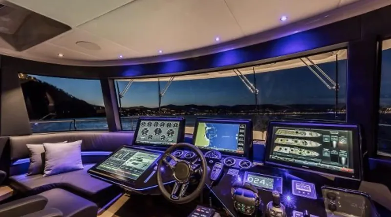 Slide: The Image of Luxurious 2025 Absolute NAVETTA 75 yacht cockpit with advanced navigation systems and ambient lighting. - 10
