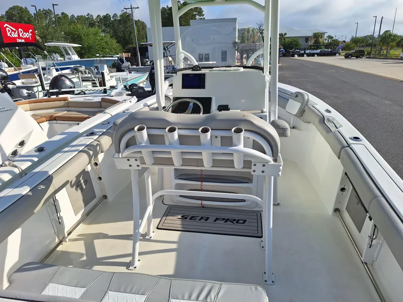 Slide: The Image of 2020 Sea Pro 219 Center Console boat interior with rod holders and seating. - 4