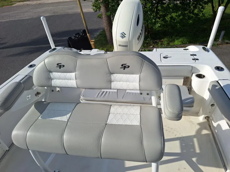 Slide: The Image of 2020 Sea Pro 219 Center Console boat with cushioned seating and Suzuki outboard motor. - 7