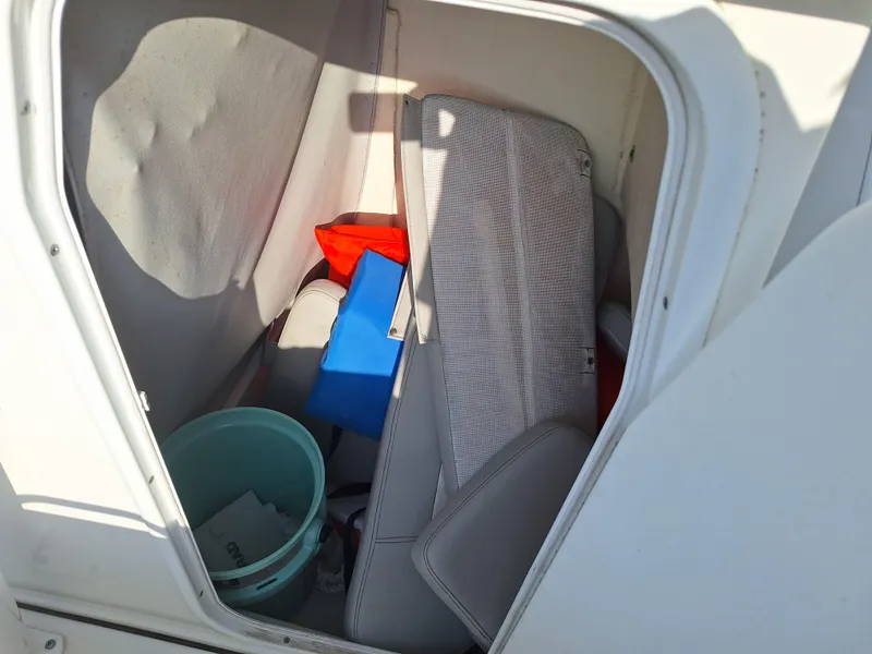 Slide: The Image of Storage compartment of 2020 Sea Pro 219 Center Console boat with various items. - 8