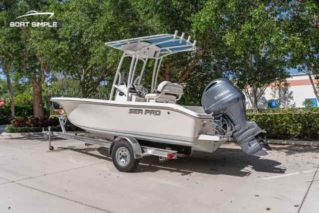 Slide: The Image of 2023 Sea Pro 199 Deep V Center Console boat on trailer, parked outdoors. - 3
