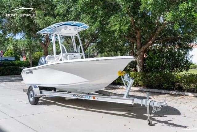Slide: The Image of 2023 Sea Pro 199 Deep V Center Console boat on trailer, parked outdoors. - 6