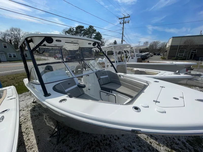 Slide: The Image of 2024 Sea Pro 240 Dual Console boat on display outdoors. - 5