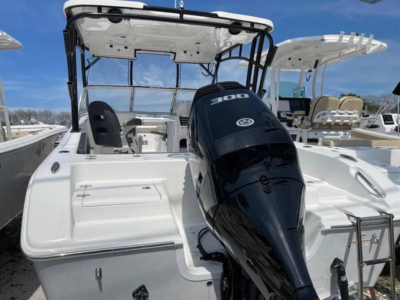 Slide: The Image of 2024 Sea Pro 240 Dual Console boat with powerful 300 HP engine. - 6