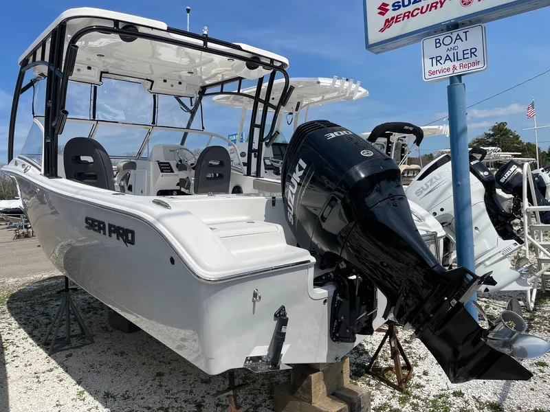 Slide: The Image of 2024 Sea Pro 240 Dual Console boat on display with Suzuki outboard motor. - 7