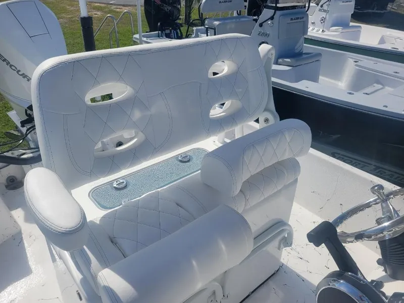 Slide: The Image of 2024 Blazer Bay 2400 boat interior with storage compartments. - 11