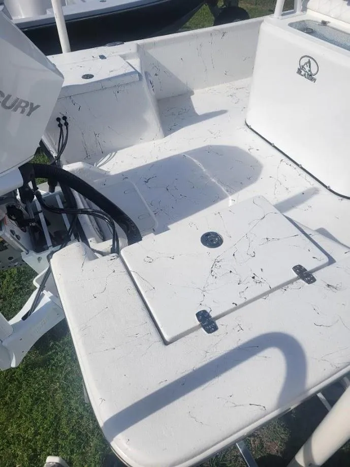 Slide: The Image of 2024 Blazer Bay 2400 boat deck with storage compartments. - 5