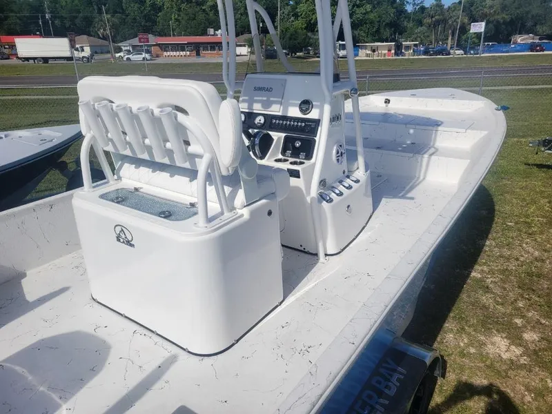 Slide: The Image of 2024 Blazer Bay 2400 boat with center console in a marina. - 6