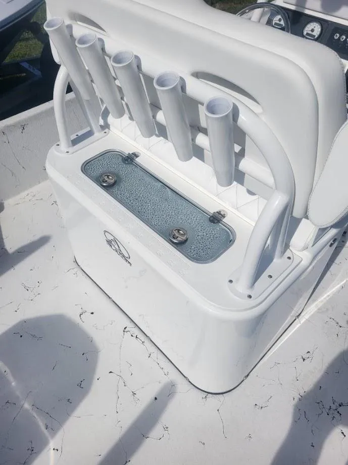 Slide: The Image of 2024 Blazer Bay 2400 boat with white interior and modern console. - 8