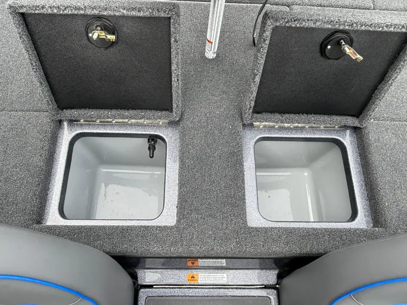 Slide: The Image of 2024 Triton 19 TrX boat storage compartments. - 13