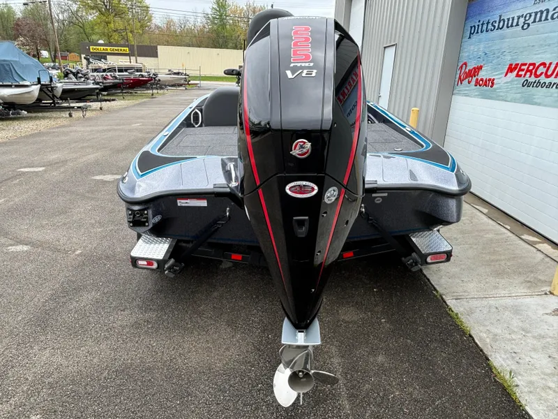 Slide: The Image of 2024 Triton 19 TrX boat with powerful V8 engine, rear view at dealership. - 18